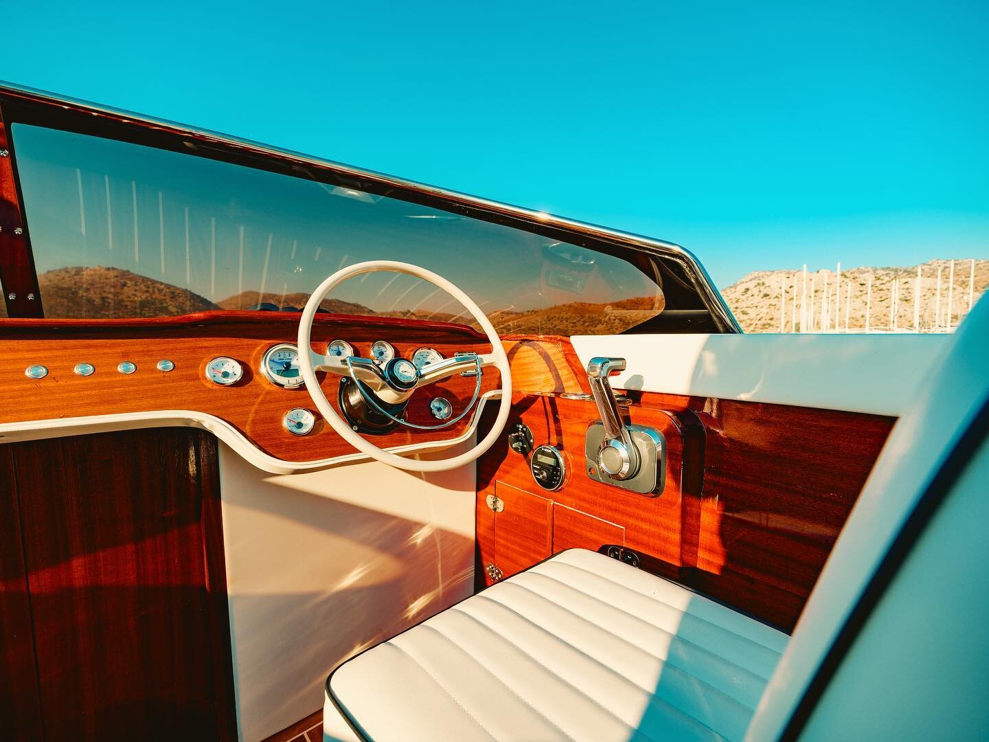 Aurora 27 cockpit and windshield over turquoise water