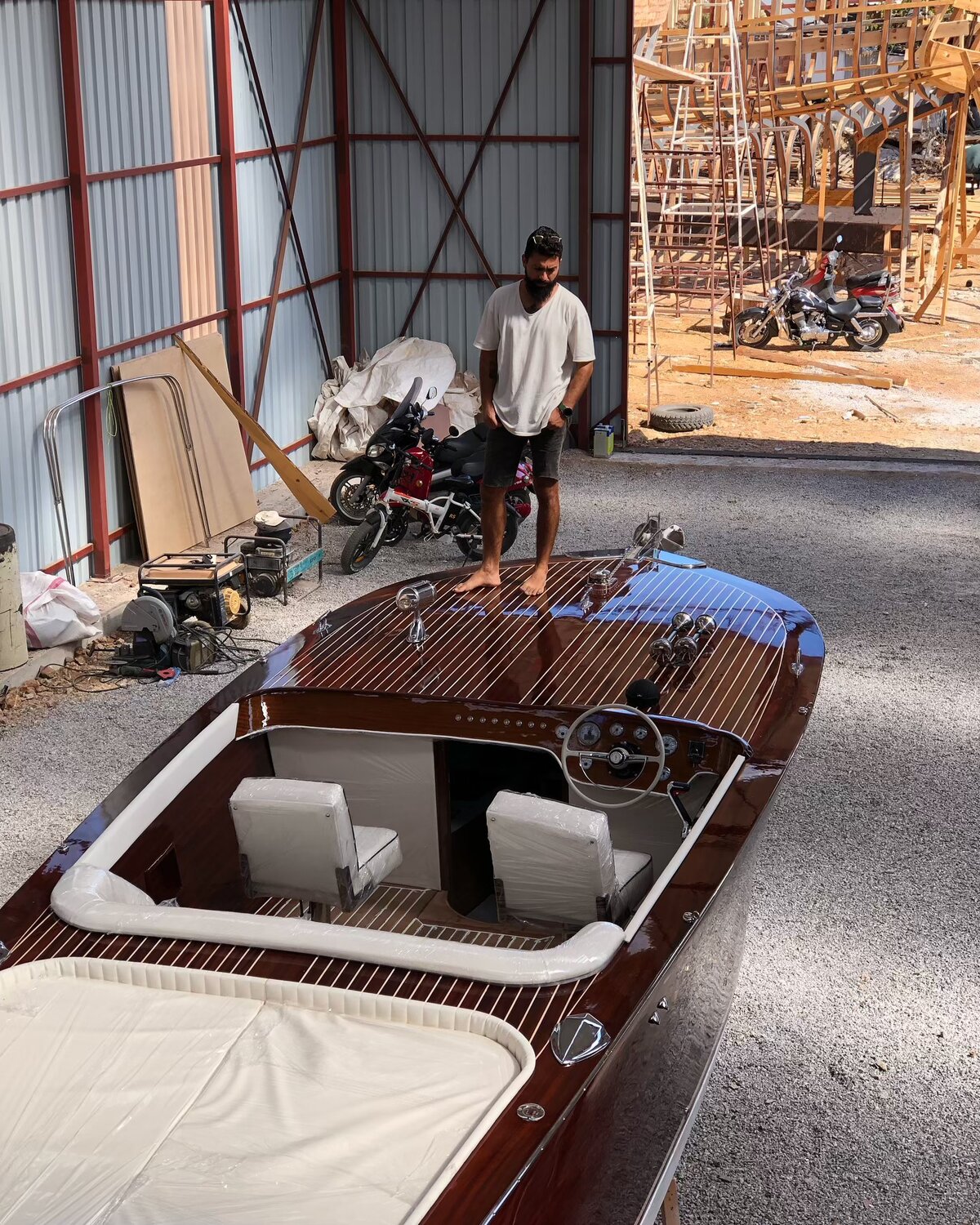 Mirror varnish on Aurora 27's mahogany aft deck