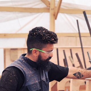 The founder at work, covered in sawdust